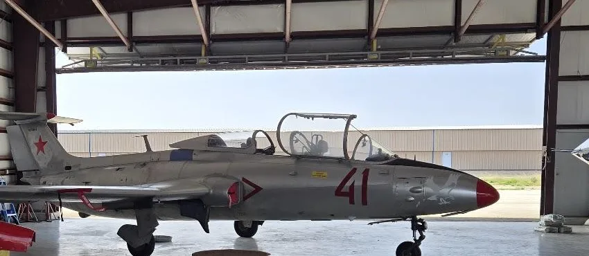 The L-29 Delfín parked in the hangar at Aransas County Airport